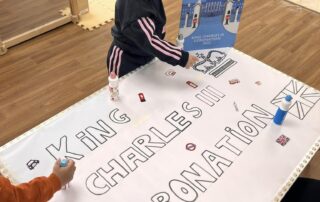 decorating a banner for the coronation