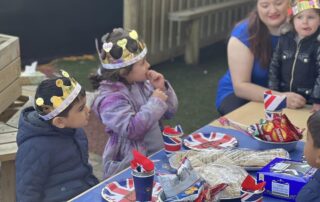 nursery children enjoying coronation lunch