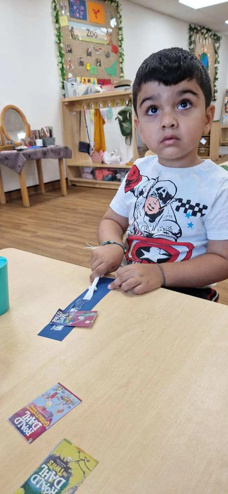 nursery children making bookmarks