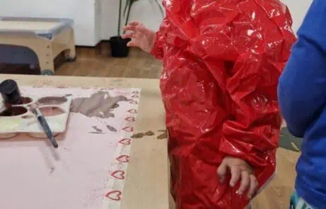 nursery child ready for painting activity nursery child ready for painting activity