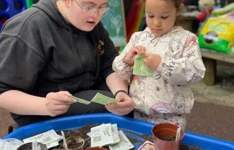 Nursery child ready to plant seeds