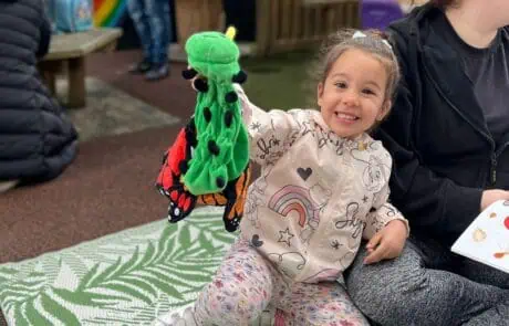 Nursery child with butterfly toy